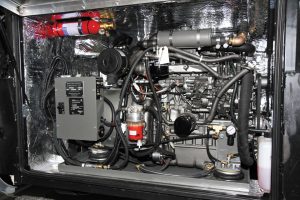 This Martin 20-kw open-frame generator sits inside a soundproof enclosure, with remote cooling, in a Newell motorhome.