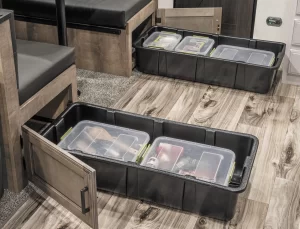 Large, removable bins stow beneath each dinette bench.