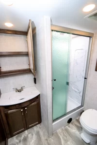 The fiberglass shower comes with sliding doors.