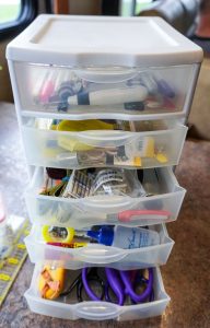 Diane uses a miniature five-drawer plastic organizer to hold sewing essentials.