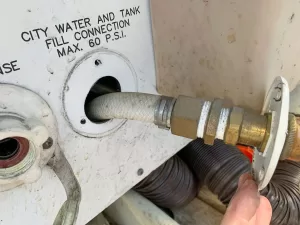 Carefully pull the old fitting away from the RV. 