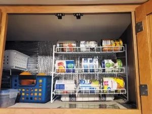 Storing canned goods horizontally saves space and allows room for other items.