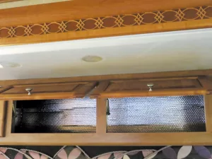 Lining cabinets with foil-faced bubble wrap can help to keep the heat outside and away from food items.