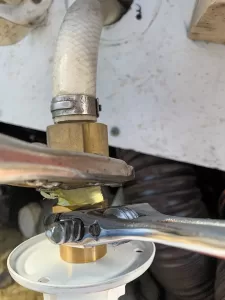 After tightening by hand, use wrenches to snug it up.