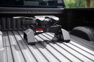 Full-size pickup manufacturers offer factory-installed fifth-wheel-hitch mounting kits, along with dealer-sold/installed hitches, such as this Curt unit in a Chevrolet bed.