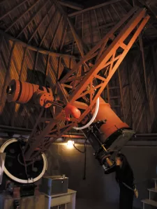 Lowell Observatory in Arizona houses the telescope used to discover Pluto in 1930.