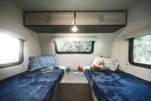 The E20’s front sleeping area can be set up with two 32-inch-by-74-inch twin beds and a nightstand.