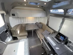 Aft of the 25FB’s galley and optional office area is the rear dinette, which comes with Ultraleather-covered cushions and folds into a bed for two.