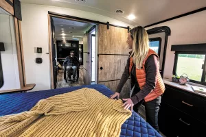 The Keystone Outback 342CG has wide sliding barn doors for easy access to the bathroom and bedroom.