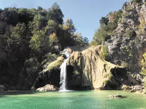 Turner Falls Park, nestled in the Arbuckle Mountains near Davis, Oklahoma, features caves and other geological formations, along with the state’s largest waterfall, photographed here by Mona Ashmore.