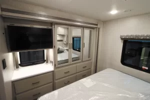 The 34R has a wardrobe and a dresser opposite the bed, plus a 32-inch LED TV.