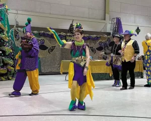Fun costumes in Mardi Gras colors were sported by members of FMCA's Cruisin' Cajuns chapter during their March rally.