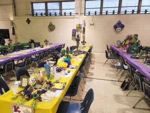 The Cruisin’ Cajuns know how to celebrate in style, and for their March 2023 Mardi Gras rally in Rayne, Louisiana, they decorated everything from the tables to the walls.