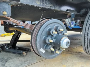 The typical RV trailer leaf-spring suspension has only about two inches of total travel — less when it’s fully loaded.