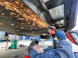 The original axles and springs are dropped out, spring hanger brackets removed, and frame rails prepped for the risers that each MORryde axle will be welded to.
