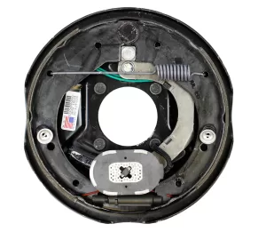 Most electric trailer brakes have an electromagnet that, when energized, attaches to the magnet surface of the drum, pulling the armature and forcing the shoes against the drum’s braking surface.