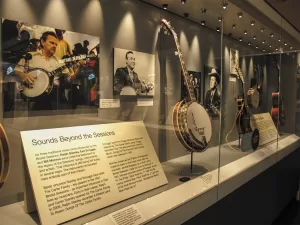 Many string instruments are on display at the Birthplace of Country Music Museum.