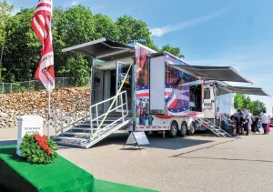 This 48-foot mobile exhibit has a 24-person screening room that showcases a video about Wreaths Across America’s mission, as well as storyboards and other displays. 
