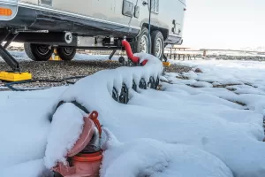 To use an RV plumbing system during freezing weather, all of it must be kept warm.