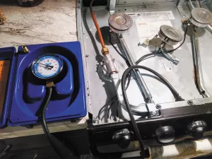 An RV’s propane system and gas range need to be tested routinely using a leak detector.