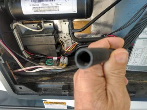 Refrigerator components on the exterior of the RV should be visually inspected.