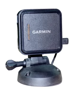 The Garmin GPS comes with a magnetic mount to hold the unit in place and can be secured to the dash or overhead cabinet using the screw-down base shown here.