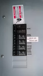 An RV with a factory-installed inverter/charger will likely have two breaker panels. The main panel is fed from the shore power cord, or generator via a transfer switch, and allows for branch circuit power distribution. 