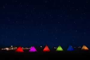 Colorful tepees light the night at Yellowstone RV Park.