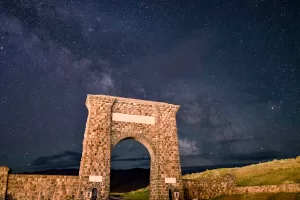 The Roosevelt Arch welcomes visitors at the North Entrance to Yellowstone National Park.