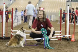 Nick enjoys a moment with Fiona after she earned an AKC national title. 