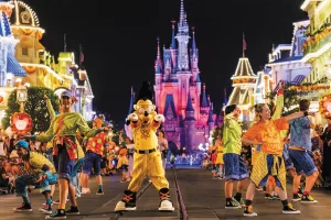 Characters parade through the streets during Mickey’s Not-So-Scary Halloween Party