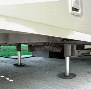 The pretrip checklist should include a note to ensure that stabilizing or leveling jacks are fully retracted before departure.