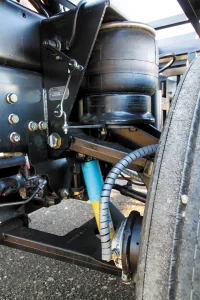 A portion of the front suspension on the author’s motorhome, which shows the air spring, control arms, Bilstein shock absorber, and ride-height control valve.
