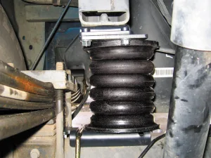 SumoSprings, shown here mounted next to a leaf spring, can enhance ride quality.