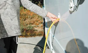 RV owners need to know how to fill the fresh water tank and to connect a water hose to the city water connection.