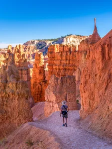 Adding a small figure to a composition contrasts the vastness of the setting, giving scale and depth to the scene.