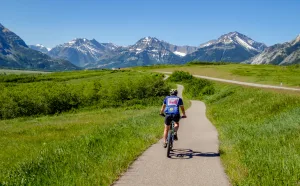 In Alberta, riders take in the glacial peaks of Waterton Lakes National Park.