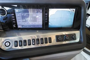 With this dual monitor system, the rear camera displays on the right screen; the left screen can be used for GPS navigation, entertainment center controls, or side cameras.