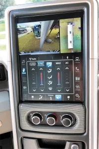 A display on the author’s coach shows the 360-degree and rear views, plus a touch screen for multiplex system controls.