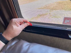 Jalousie-style exit windows have a screen that must be pulled off first.