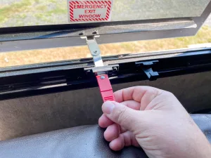 Unlatch the arm and move it outward to open the window. 