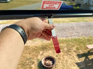 After it is unlatched, push the window all the way open to exit.