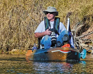 The author selected a pedal-driving fishing kayak, which is equipped with a raised seat and provides a stable base.