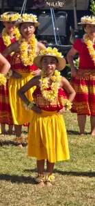 The Aloha Beach Festival in Ventura, California, features surfing events, vendors, live music, and Hawaiian dancing, the latter photographed here by Chelle Feldman. 