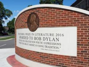 Hibbing, Minnesota, pays tribute to musician Bob Dylan, its most famous resident, with a display wall in front of the high school where he graduated in 1959.