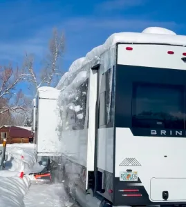 2) The True topper removes snow from the top of a slideout room on a Brinkley fifth wheel.