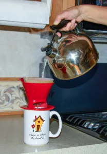 One way to conserve electricity is to make pour-over coffee instead of using a coffee maker.