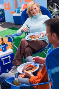Good food, good friends, and a nearby RV with a full kitchen and bathroom help to create a successful tailgating event.